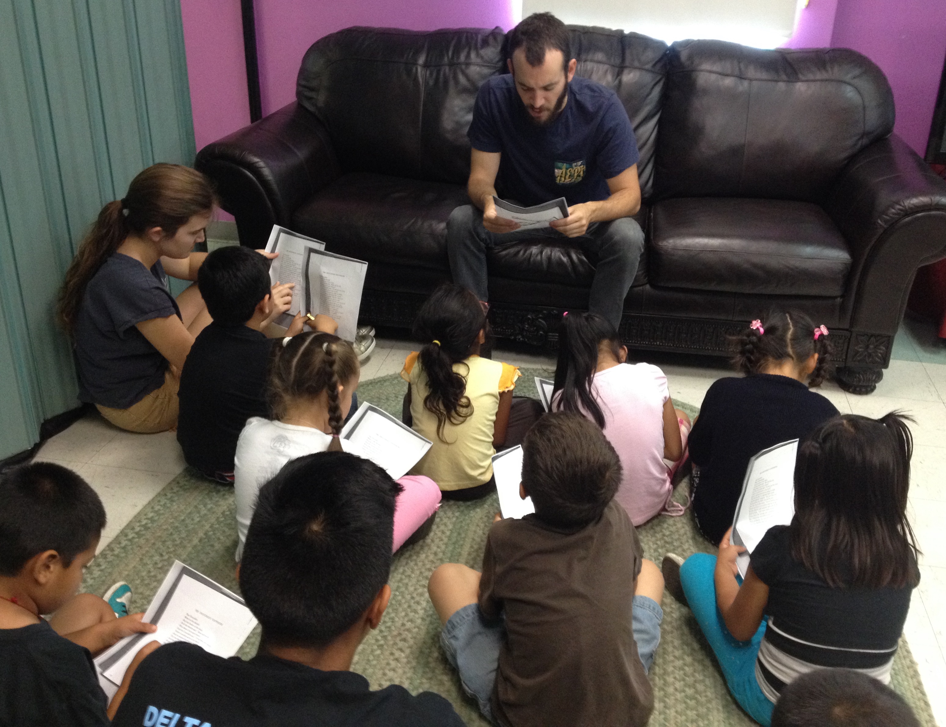EdBoost Tutors Reading with Kids in the Children's Collective Summer Program